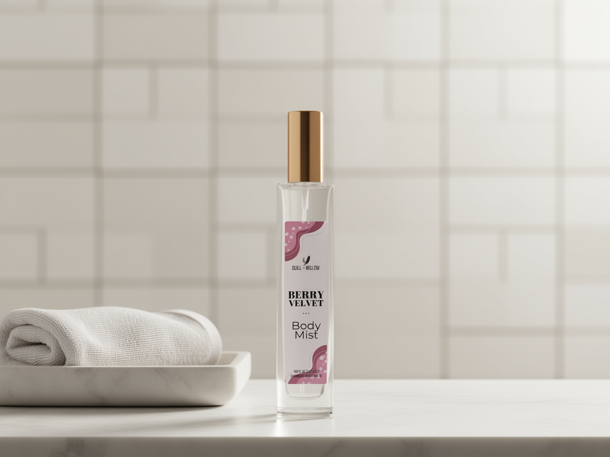 A bottle of Berry Velvet Body Mist stands on a white marble countertop next to a folded white towel, with a softly blurred white tiled bathroom wall in the background.