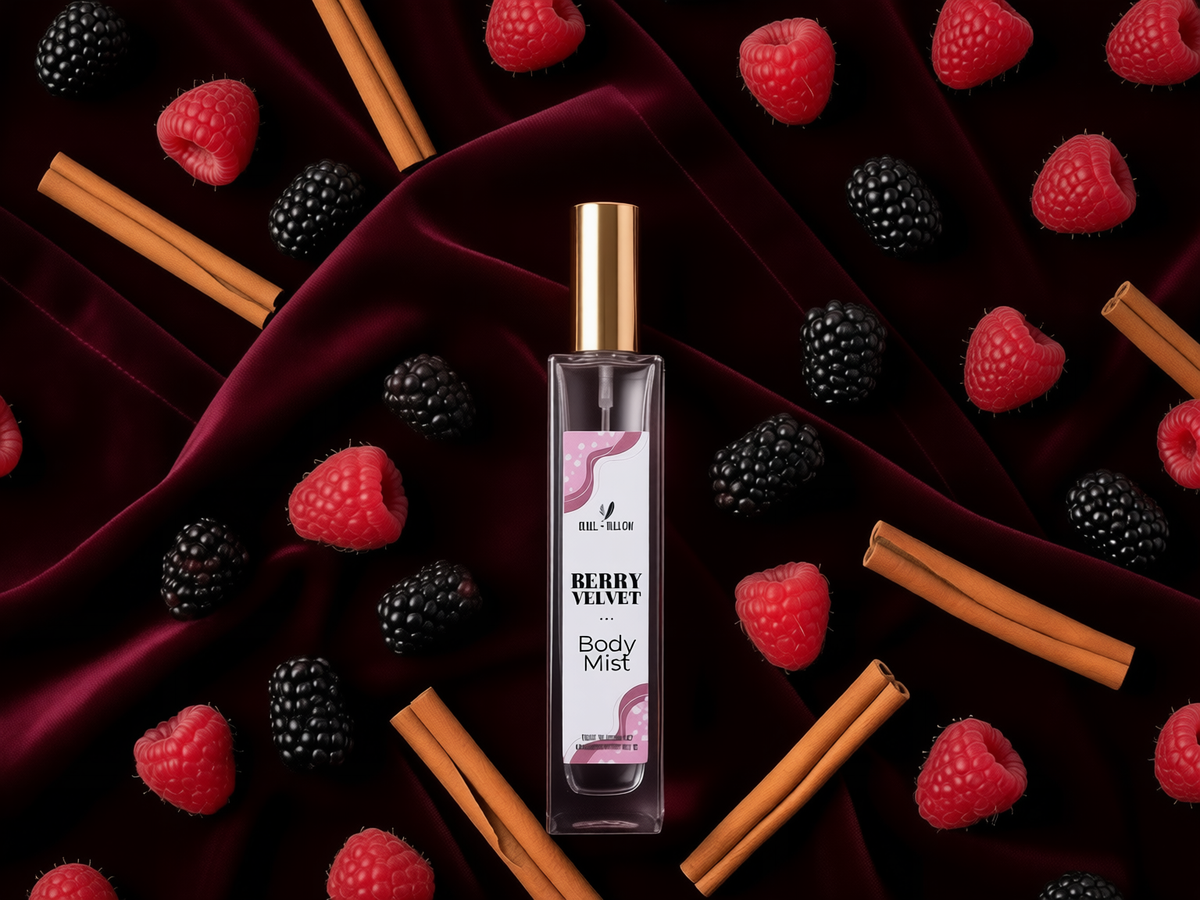A bottle of Body Mist, Berry Velvet scent, centered on a dark burgundy velvet background decorated with fresh raspberries, blackberries, and cinnamon sticks.