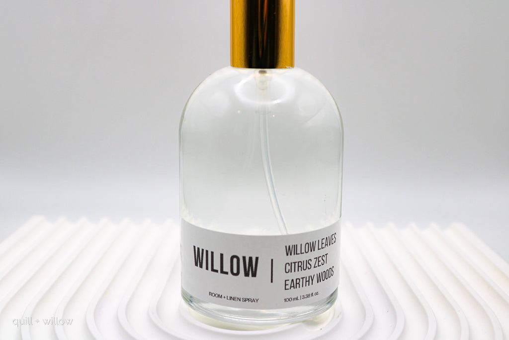 Bottle of 'Willow' room spray with a gold cap on a white background