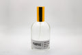 Bottle of Pampas room spray on a light gray background