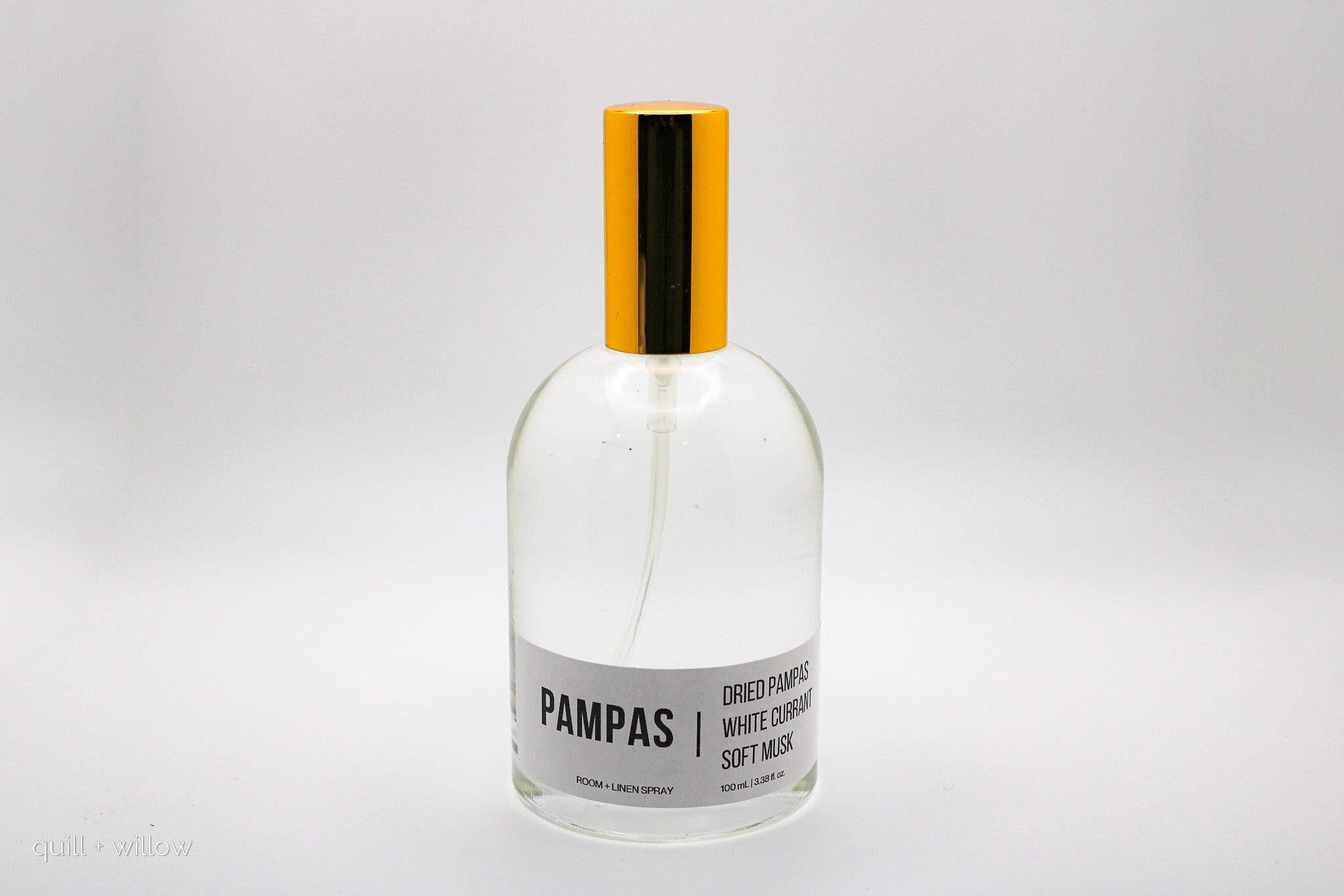 Bottle of Pampas room spray on a light gray background