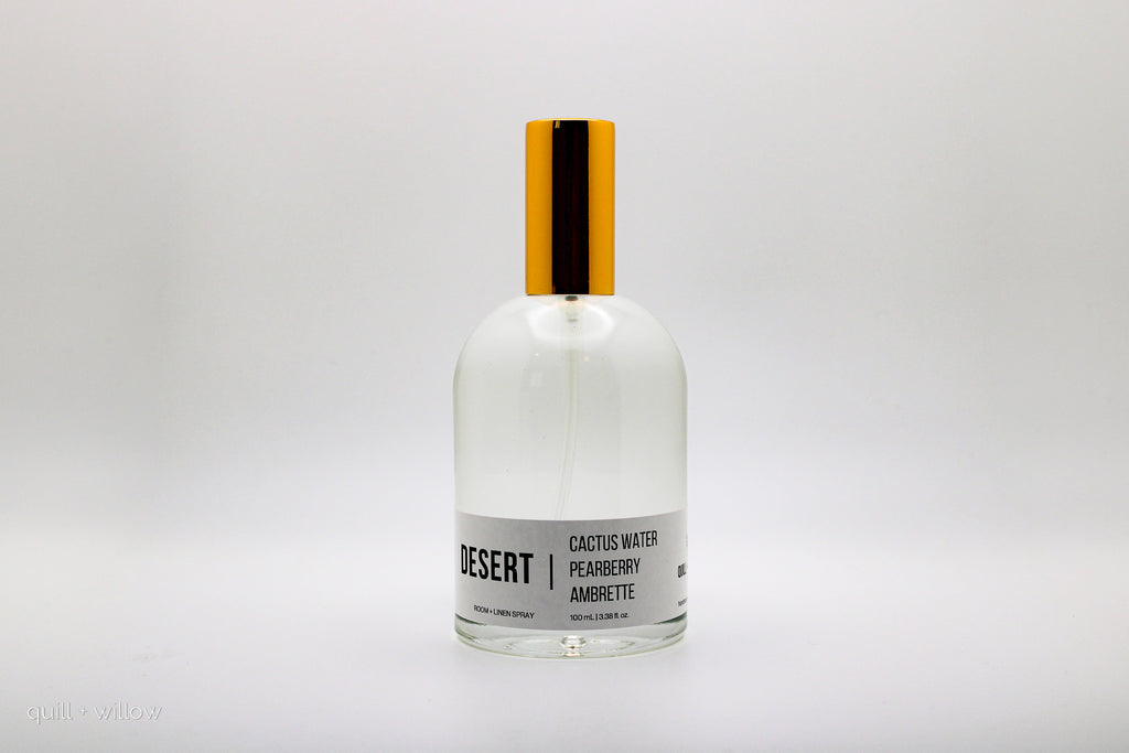 Clear bottle with gold cap on a white background