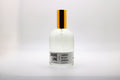 Bottle of 'Shore Line' room spray scented with lavender sea salt and oatgrass on a white background