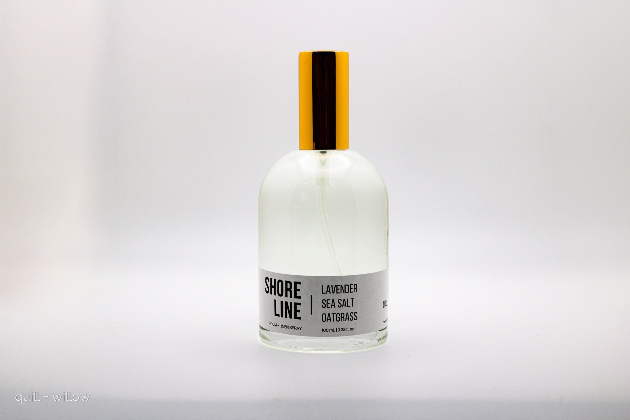 Bottle of 'Shore Line' room spray scented with lavender sea salt and oatgrass on a white background