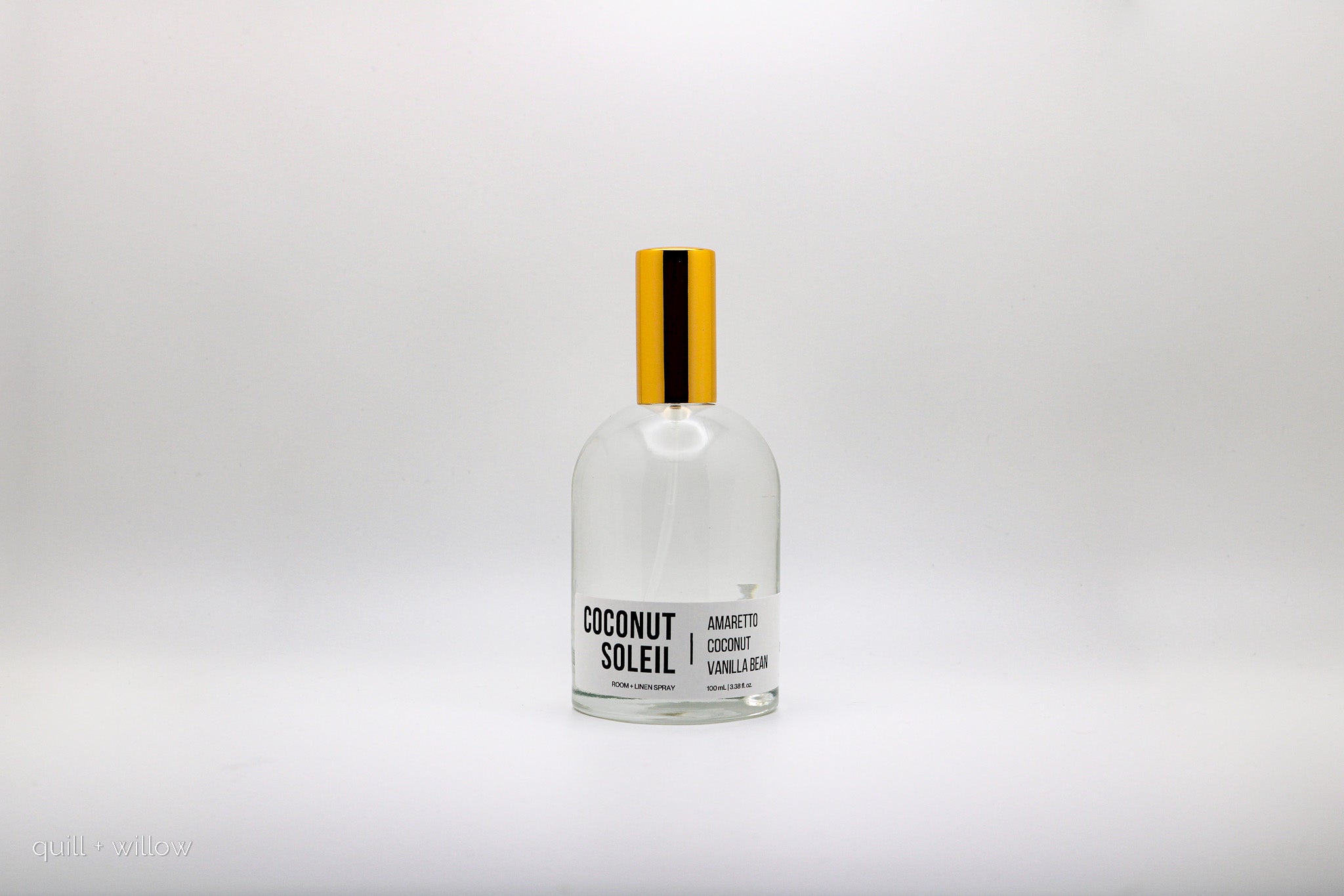 Bottle of Coconut Soleil room spray on a white background
