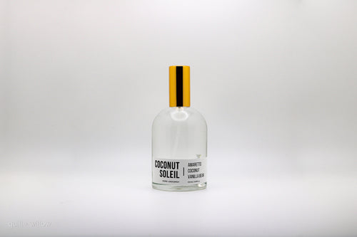 Bottle of Coconut Soleil room spray on a white background