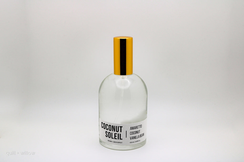 Clear bottle with gold cap labeled 'Coconut Soleil' on a white background