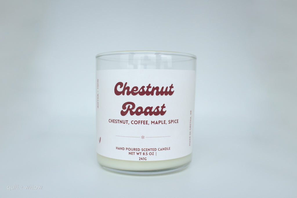 Candle with 'Chestnut Roast' label on a white background