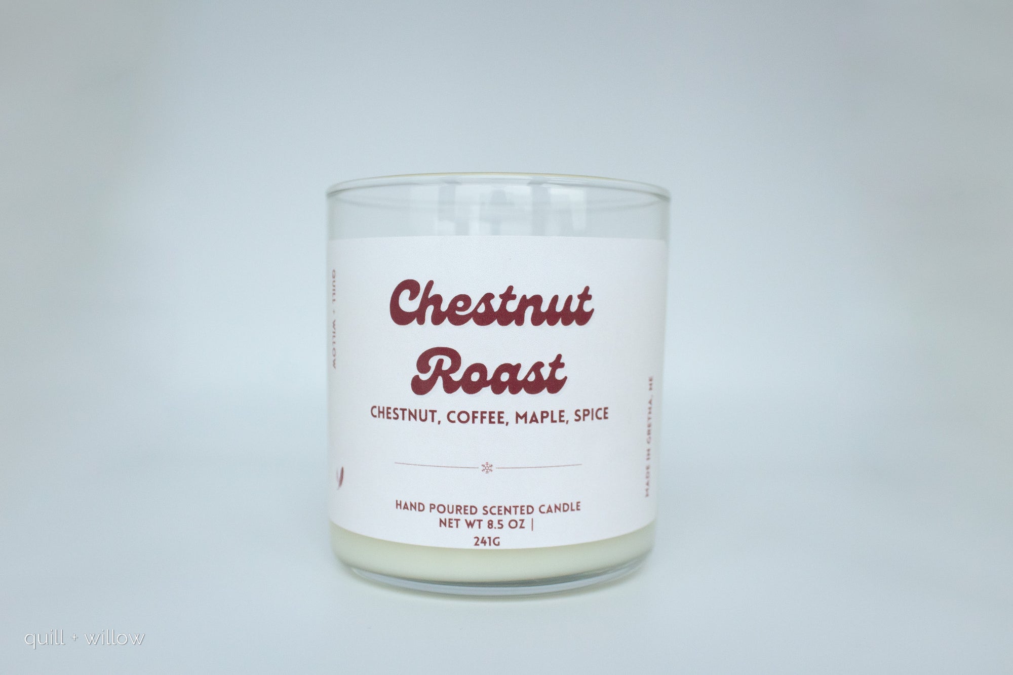 Candle with 'Chestnut Roast' label on a white background