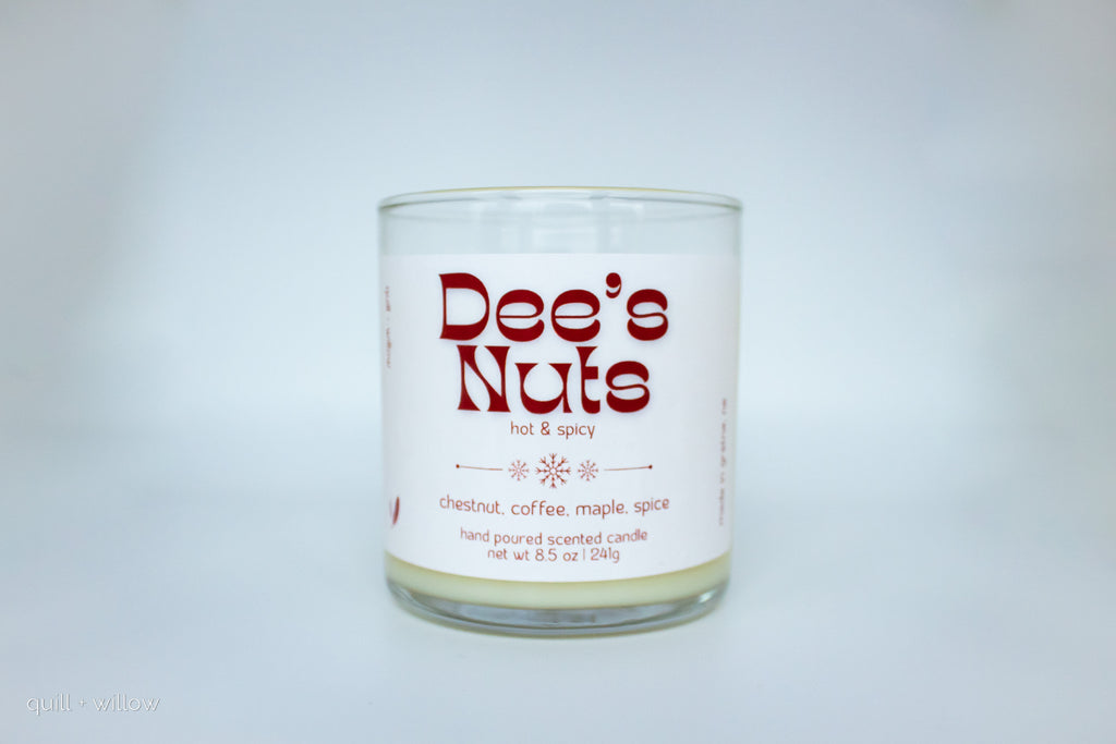 Candle with 'Dee's Nuts' label on a white background