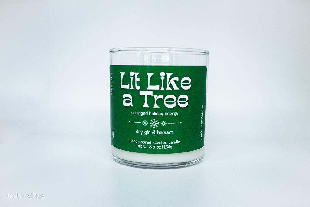 Candle with a green label on a white background