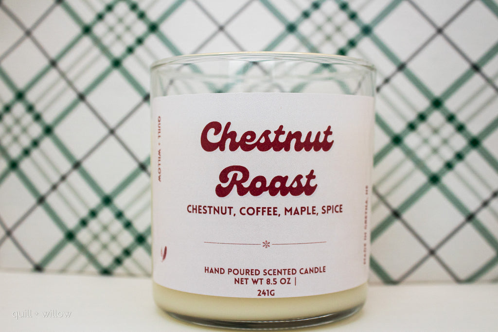 Candle with 'Chestnut Roast' label against a checkered background