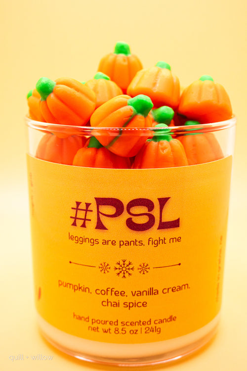 Pumpkin-shaped candles in a container with text on a yellow background