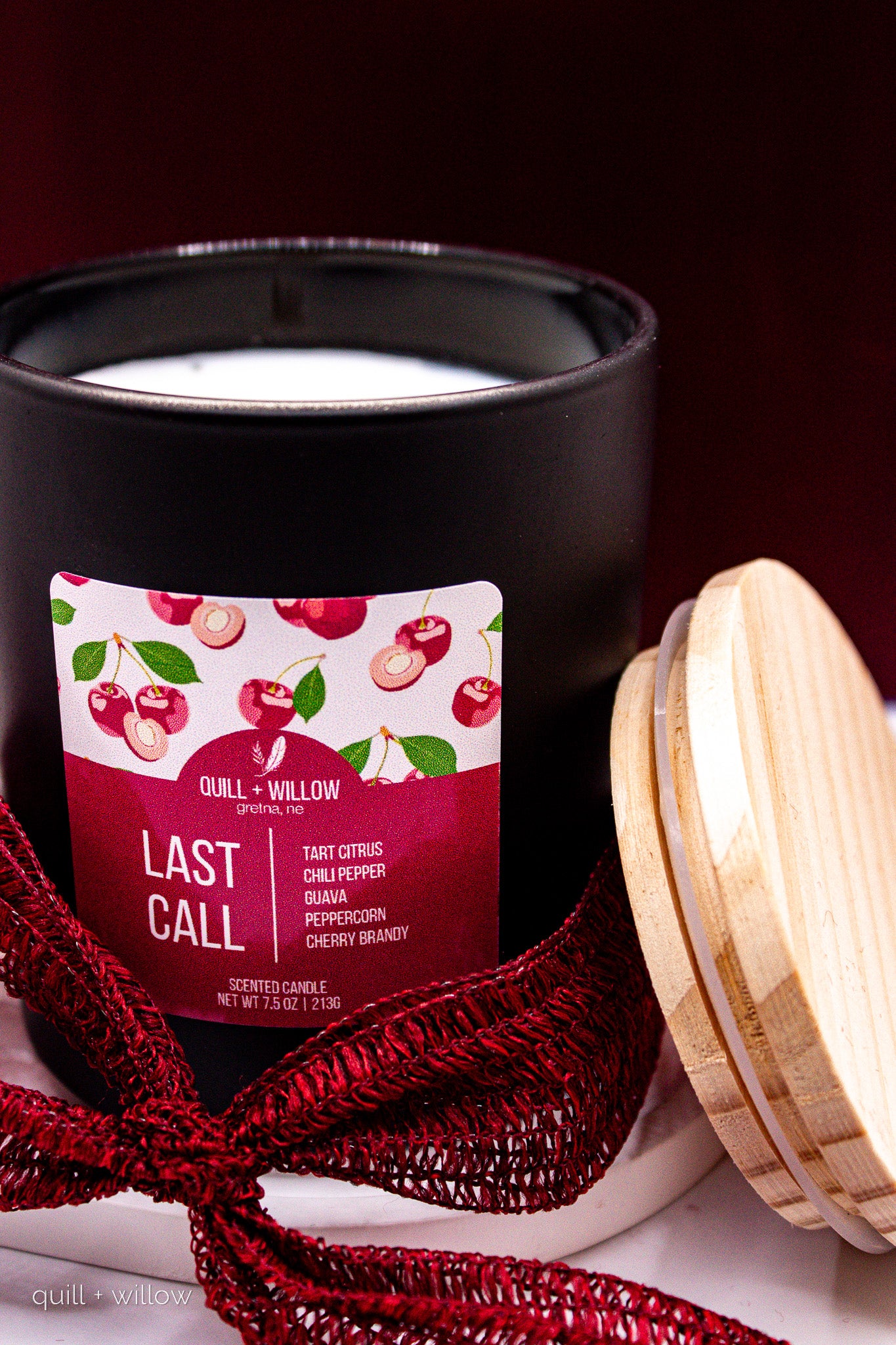 Candle with a label on a dark background
